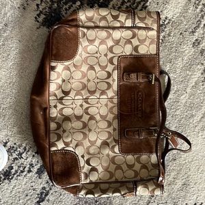 Coach tote. Used and has marks inside.